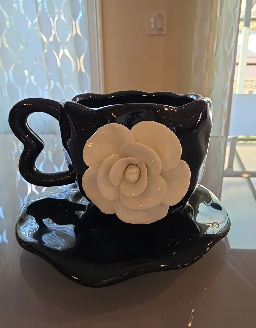 Set Of 2 Decorative Black Ceramic Teacup And Saucer with White Flower Accent 3D